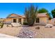 A charming single-story home with low-maintenance desert landscaping and rock accents at 6533 E Kelton Ln, Scottsdale, AZ 85254