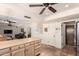 View of a spacious kitchen with a breakfast bar open to the living room and other rooms at 6533 E Kelton Ln, Scottsdale, AZ 85254
