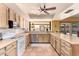 The kitchen has custom cabinets, a stainless dishwasher, and a large window above the sink at 6533 E Kelton Ln, Scottsdale, AZ 85254