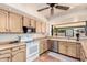 A view of a kitchen, featuring custom cabinets and a large window with a view of the backyard at 6533 E Kelton Ln, Scottsdale, AZ 85254