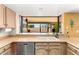 A view of the kitchen sink and stainless dishwasher with a view out to the backyard at 6533 E Kelton Ln, Scottsdale, AZ 85254