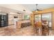 Eat-in kitchen featuring stainless steel appliances, breakfast bar, and tile flooring at 6533 E Kelton Ln, Scottsdale, AZ 85254