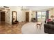 Inviting living room with tile entryway, carpeted seating area, and natural light at 6533 E Kelton Ln, Scottsdale, AZ 85254