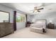 A comfortable main bedroom featuring a ceiling fan, natural light, and neutral decor at 6533 E Kelton Ln, Scottsdale, AZ 85254