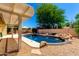 Backyard oasis featuring a beautiful in-ground pool, patio, and lush landscaping, perfect for summer fun at 6533 E Kelton Ln, Scottsdale, AZ 85254