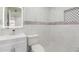 Well-lit bathroom featuring mosaic tile accents, vanity, and illuminated mirror at 655 E Hondo Ave, Apache Junction, AZ 85119