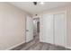 Bedroom featuring neutral walls, grey floors, and a closet with sliding doors at 655 E Hondo Ave, Apache Junction, AZ 85119