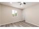 Well-lit bedroom with neutral walls and a window with greenery view at 655 E Hondo Ave, Apache Junction, AZ 85119