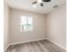 Bright bedroom with a ceiling fan and a window with a green cactus view at 655 E Hondo Ave, Apache Junction, AZ 85119