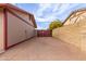 Long driveway area with high wooden and metal access gates at 655 E Hondo Ave, Apache Junction, AZ 85119