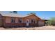Charming single-story home featuring a well-maintained front yard and attached garage at 655 E Hondo Ave, Apache Junction, AZ 85119