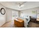 Inviting bedroom with neutral walls, ceiling fan, and French doors to the outside at 6938 W Wescott Dr, Glendale, AZ 85308