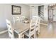 Dining room with a large table, upholstered chairs, and views to the stairway at 6938 W Wescott Dr, Glendale, AZ 85308