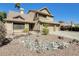 Attractive two-story home with a three-car garage, desert landscaping, and a private balcony at 6938 W Wescott Dr, Glendale, AZ 85308