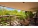 Balcony with a wooden table and chairs and views of the neighborhood at 7117 E Rancho Vista Dr # 2003, Scottsdale, AZ 85251