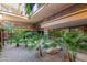 Lush courtyard with tropical landscaping, stone accents, and walkways at 7117 E Rancho Vista Dr # 2003, Scottsdale, AZ 85251