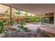 Lush courtyard with tropical landscaping, stone accents, and walkways at 7117 E Rancho Vista Dr # 2003, Scottsdale, AZ 85251