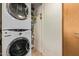 Stacked washer and dryer, next to shelving, for storage at 7117 E Rancho Vista Dr # 2003, Scottsdale, AZ 85251