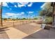 Serene backyard features gravel, iron fencing, and a covered patio for outdoor enjoyment at 7302 E Baseline Rd, Mesa, AZ 85209