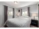Welcoming bedroom features two windows providing ample natural light and fresh air at 7302 E Baseline Rd, Mesa, AZ 85209