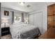Comfortable bedroom boasts great natural light and functional closet storage at 7302 E Baseline Rd, Mesa, AZ 85209