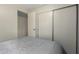 Bedroom featuring neutral decor and built-in storage maximizing space and style at 7302 E Baseline Rd, Mesa, AZ 85209