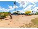 Community with desert landscaping, serene outdoor environment, and bright blue sky at 7302 E Baseline Rd, Mesa, AZ 85209