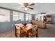 Open-plan dining space connected to living room, perfect for entertaining and casual living at 7302 E Baseline Rd, Mesa, AZ 85209