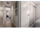 Inviting hallway with warm, wood-look floors leads to comfortable bedrooms at 7302 E Baseline Rd, Mesa, AZ 85209