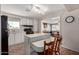 Well-lit kitchen with an island counter, connecting to the dining area, perfect for entertaining at 7302 E Baseline Rd, Mesa, AZ 85209