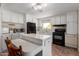 Clean, white kitchen with modern appliances and functional layout, ready for your culinary adventures at 7302 E Baseline Rd, Mesa, AZ 85209