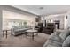 Spacious living room with a comfortable seating arrangement, allowing for easy access to the kitchen space at 7302 E Baseline Rd, Mesa, AZ 85209