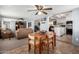 Combined living and dining area creating a spacious layout, perfect for modern living at 7302 E Baseline Rd, Mesa, AZ 85209