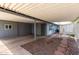 A covered patio area with a unique stone path. Perfect for entertaining or relaxing outdoors at 7302 E Baseline Rd, Mesa, AZ 85209