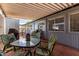 Charming covered outdoor patio with dining set, perfect for relaxing and enjoying the outdoors at 7302 E Baseline Rd, Mesa, AZ 85209