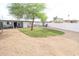 Expansive backyard with artificial grass, gravel, and white brick walls for privacy at 7802 E Kimsey Ln, Scottsdale, AZ 85257