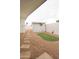 Landscaped backyard with a putting green, shed, gravel area, and partial fencing for outdoor recreation at 7802 E Kimsey Ln, Scottsdale, AZ 85257