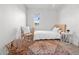 Small bedroom with a bed, wood floors and a bright window at 7802 E Kimsey Ln, Scottsdale, AZ 85257
