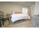 Bright bedroom featuring a king-sized bed, neutral tones, and direct access to an outdoor patio at 7802 E Kimsey Ln, Scottsdale, AZ 85257
