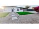 Charming home with a xeriscaped yard, stepping stone path, and a minimalist exterior at 7802 E Kimsey Ln, Scottsdale, AZ 85257