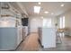 Well-lit modern kitchen with an island, stainless steel appliances, and stylish cabinetry at 7802 E Kimsey Ln, Scottsdale, AZ 85257