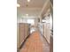 Open kitchen featuring an island with a cooktop, leading to a comfortable living space at 7802 E Kimsey Ln, Scottsdale, AZ 85257
