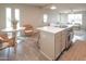 Bright, airy kitchen with stainless steel appliances, an island cooktop, and stylish dining area at 7802 E Kimsey Ln, Scottsdale, AZ 85257