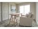 Bright room featuring wood floors, white walls, light-colored furniture, and sliding glass door at 7802 E Kimsey Ln, Scottsdale, AZ 85257