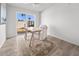 Bright office space with a wooden desk, a chair and a view to the backyard at 7802 E Kimsey Ln, Scottsdale, AZ 85257
