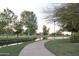 Picturesque park with a walking path, serene canal, and lush greenery at 7802 E Kimsey Ln, Scottsdale, AZ 85257