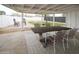 Covered patio with outdoor seating, providing a relaxing space for gatherings and enjoying the backyard at 7802 E Kimsey Ln, Scottsdale, AZ 85257