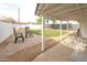 Covered patio with chairs and a brick-paved area in a spacious backyard at 7802 E Kimsey Ln, Scottsdale, AZ 85257