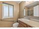 Bathroom includes a modern sink, toilet, grab bars, and shower stall at 10449 W Tropicana Cir, Sun City, AZ 85351