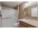 Bathroom with modern shower, toilet, and vanity with ample lighting at 10449 W Tropicana Cir, Sun City, AZ 85351